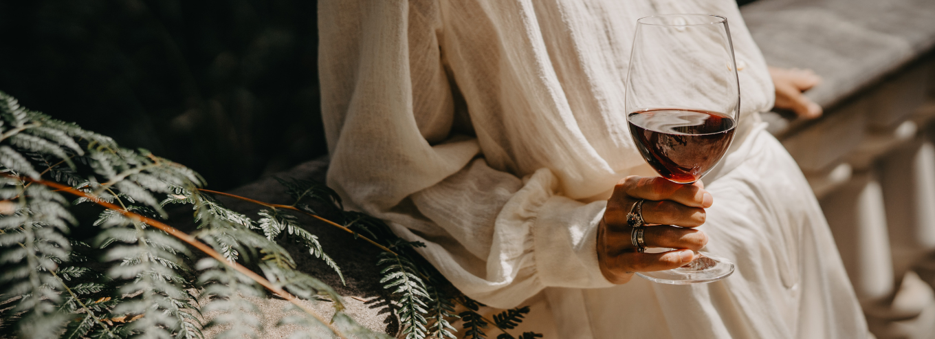 A woman with a glass of Marchand & Burch wine